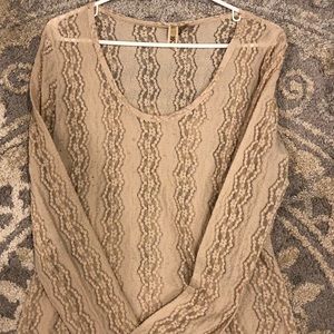 Long sleeve sheer top.